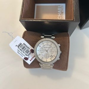 Michael Kors watch- women’s. Stainless steal with crystal details.